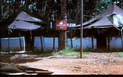 typical tent lines, x4 people to tent, iron walls contained sandbags or dirt to protect against ground detonating explosives, tent fly overhead for weather protection  [Young]