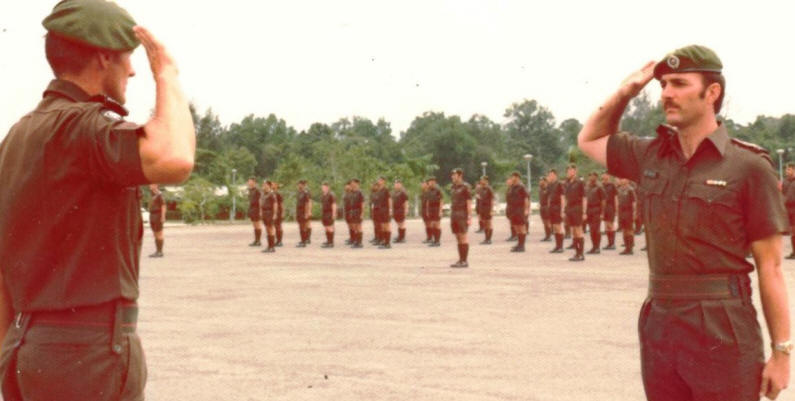 webmaster [right] as parade adjutant handing parade over to CO [his former company commander in 1970] - Dieppe Barracks Singapore late 1976 or early 1977 [Young]