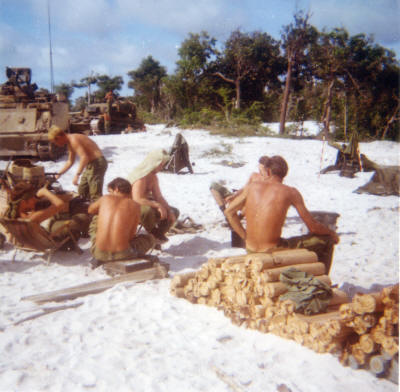 Op Massey Harris: Note the ammo & mortars have been offloaded from the APC's and are just unprotected on the sand.  This was very rare - once when the AMC's were needed as regular APC's and another time they lightened them to do track maintenance.  In the photo from left is Ross Cherry, Lance Ralph, Derek Marsh, Vince Butler, ?, Dave Condon    [Binning]