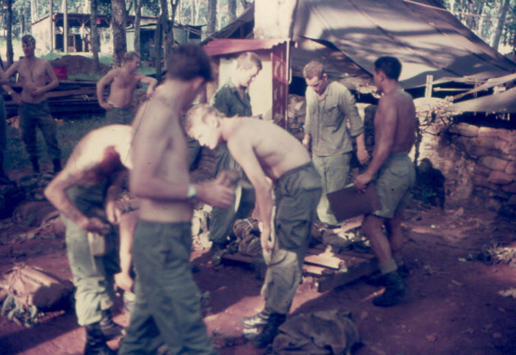 2Pl sorting equipment under Sgt Harry Hemana [wearing shorts on right] prior to returning to the field on 8 October 1970