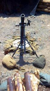 weapon of choice in SVN, US 81mm barrel & bipod, UK baseplate & sight, two mortars per section.  The brown tubes in front of the mortar are individual 81mm bombs.