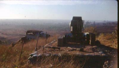 the photo looks south toward the South China Sea along the route of the minefield.  The 'Light' & 'Dark' Green operational areas were to the left near the coast, the mountains were to the right with the minefield [in theory] between to prevent VC movement     [Young]