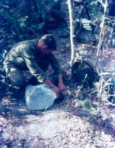 Doc Schwass filling waterbottles from a disposable bladder [Rowsell]