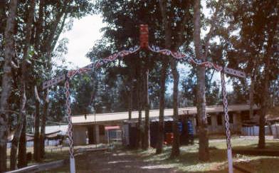 W3 Admin HQ left end, CQMS store right end with separate entrance, officer tents to right, 1PL lines visible in rear.  Not known who made archway  [Young]